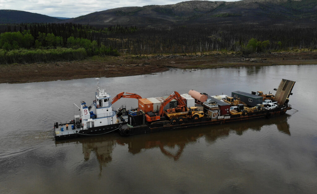 Brice Marine tug and barge carrying equipment to Crooked Creek Airport project in early June.