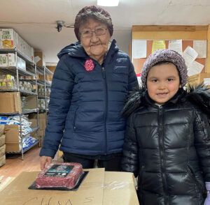 Elder Sophie Sakar brought her great granddaughter Diane to pick up her food box at the Chuathbaluk Tribal office in March 2022.