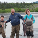 Curt Chamberlain fishing with his children on the Chitina River.